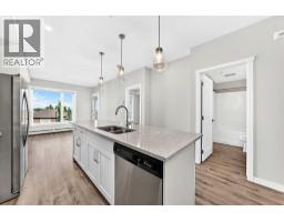 Living room - 205, 71 Shawnee Common Sw, Calgary, AB T2Y0R2 Photo 8