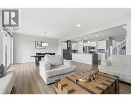 Bedroom - 15 Lawrence Green Se, Airdrie, AB T4A3M9 Photo 9