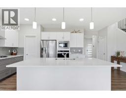 Family room - 15 Lawrence Green Se, Airdrie, AB T4A3M9 Photo 12