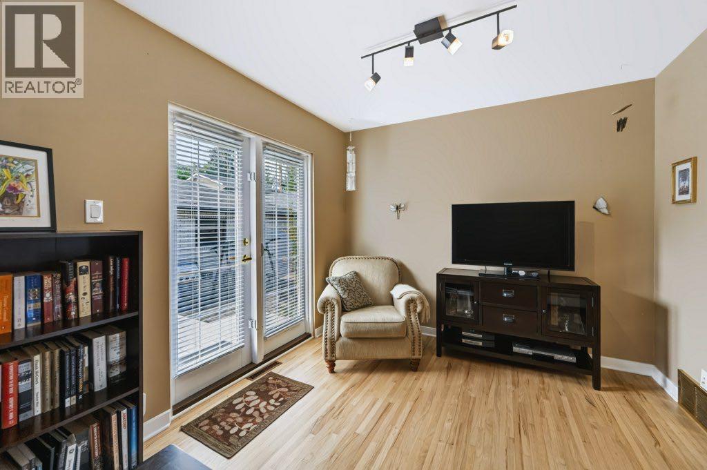 Main floor DEN with garden doors