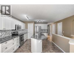 Laundry room - 22 Glensummit Close, Cochrane, AB T4C2J9 Photo 11