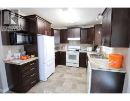 Living room - 5905 57 Street, Taber, AB T1G1K1 Photo 6