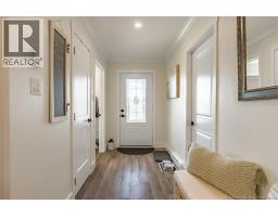 Looking from Kitchen to front entryway.