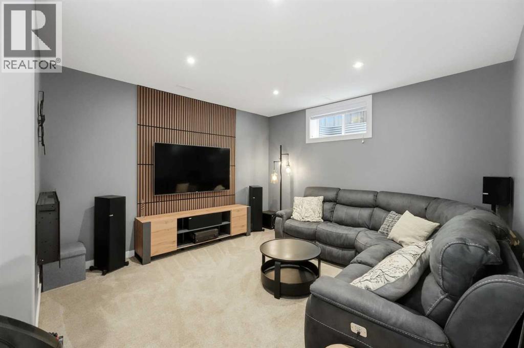 family and recreation room featuring another wood accent wall
