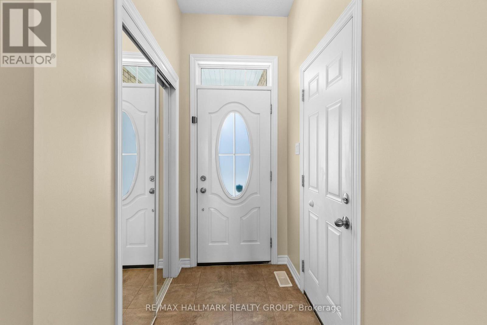 Bright front entry with hardwood flooring
