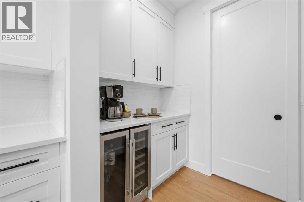 Butler's pantry added as a custom upgrade just off the kitchen with access to the mudroom which leads to the garage