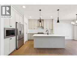 Great room - 1062 Bayview Crescent Sw, Airdrie, AB T4B5N8 Photo 9
