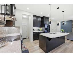Laundry room - 228 Carringham Road Nw, Calgary, AB T3J1V4 Photo 17