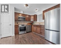 Family room - 103 Panatella Road Nw, Calgary, AB T3K0S7 Photo 9