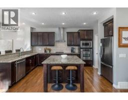 Family room - 128 Sunset Park, Cochrane, AB T4C0N5 Photo 10