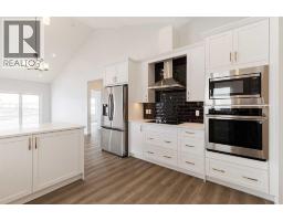Kitchen - 125 Monarch Bend, Rural Rocky View County, AB T3Z0K4 Photo 6