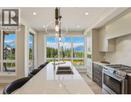 Laundry room - 201, 101h Stewart Creek Rise, Canmore, AB T1W0E3 Photo 6