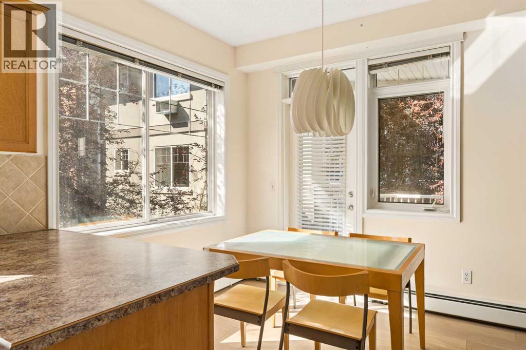 Bright dining area surrounded by windows and natural light