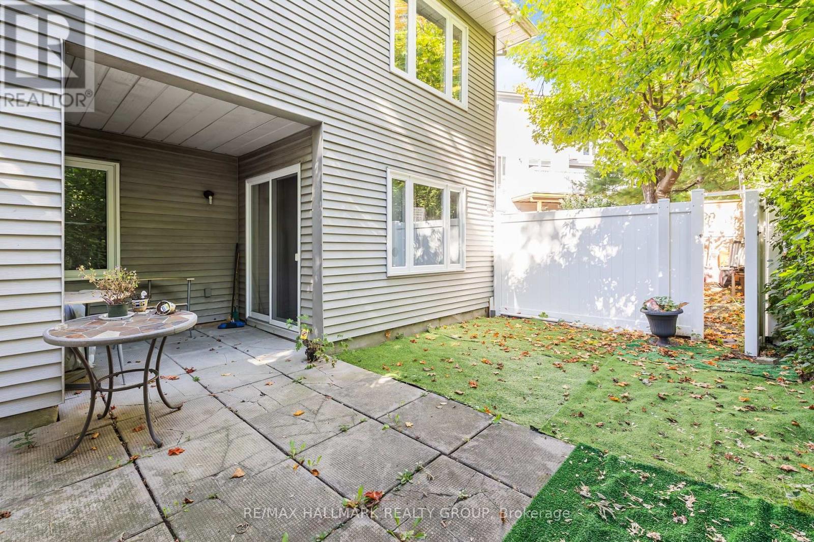 Backyard with Green and trees behind it - w/Patio