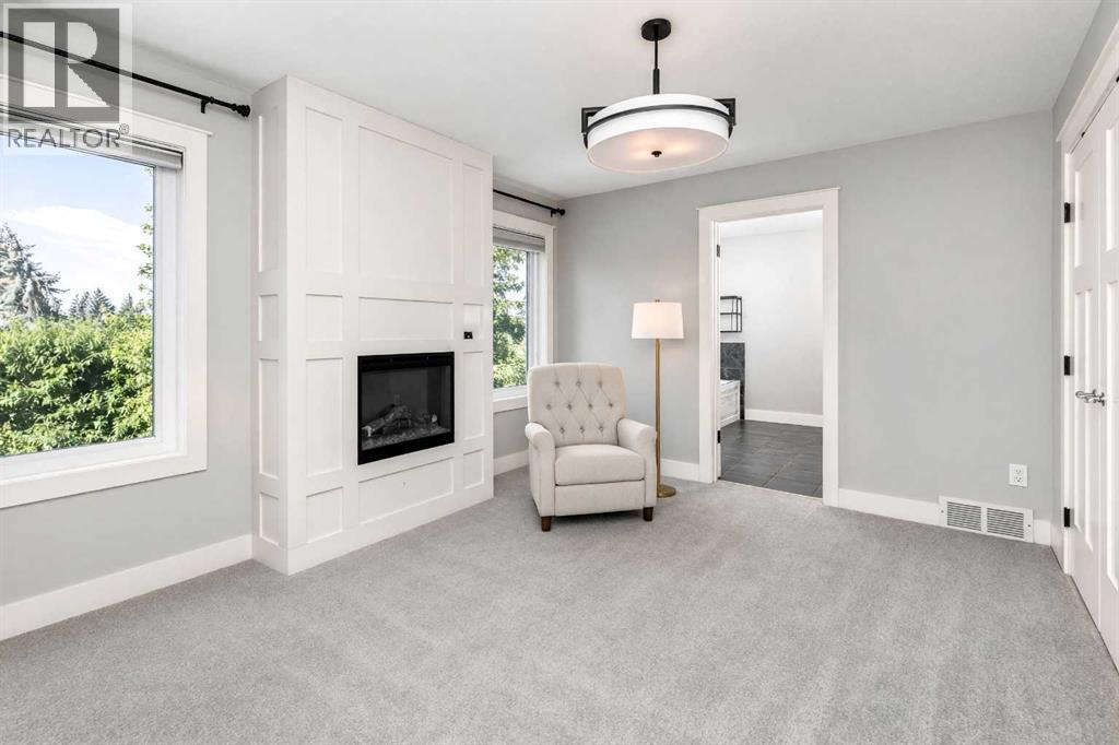 Primary bedroom den with fireplace