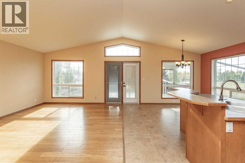 Open Living/Dining/Kitchen area with vaulted ceilings