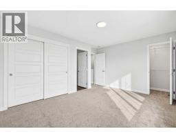 Bedroom - 105, 28 Red Embers Plaza Ne, Calgary, AB T3N2W1 Photo 11