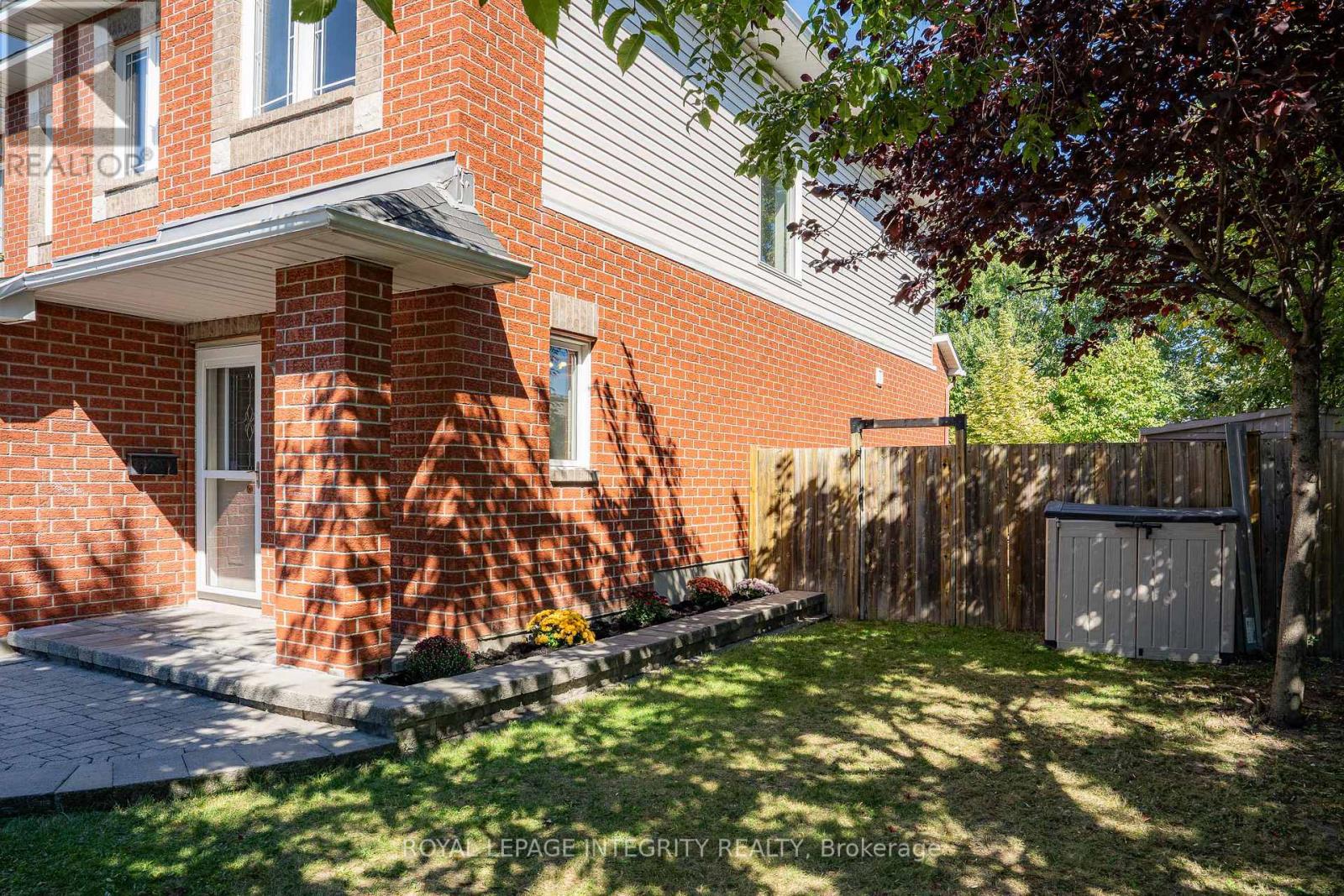 Fully fenced backyard with mature trees