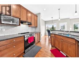 Kitchen - 316, 1 Glensummit Close Se, Cochrane, AB T4C2J9 Photo 10