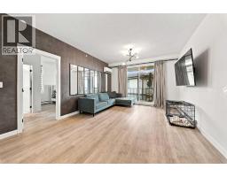 Living room - 2401, 200 Seton Circle Se, Calgary, AB T3M3X1 Photo 6