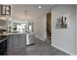 Laundry room - 212 Shawnee Square Sw, Calgary, AB T2Y0T7 Photo 14