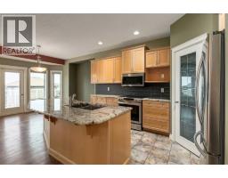Family room - 184 Sunterra Heights, Cochrane, AB T4C1W7 Photo 12