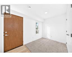 Bedroom - 105, 20295 Seton Way Se, Calgary, AB T3M3X3 Photo 6