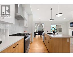 Living room/Dining room - 48 Southborough Lane, Cochrane, AB T4C3J4 Photo 11
