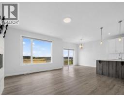 Family room - 134 Hotchkiss Manor Se, Calgary, AB T3S0J5 Photo 11