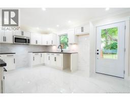 Kitchen has entry to deck in back garden