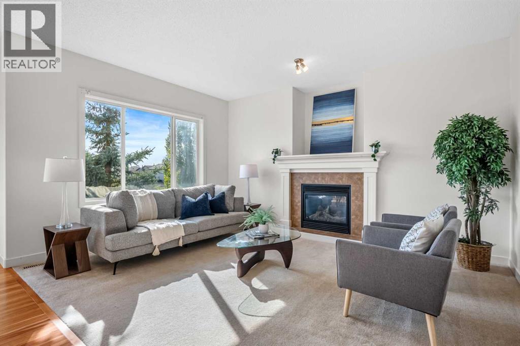 The family room brings together park views, natural light and a cozy gas fireplace