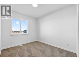 Laundry room - 12 Hotchkiss Parade Se, Calgary, AB T3S0X5 Photo 13