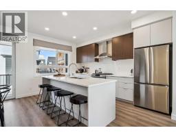 132 Quesnay Wood Link Sw, Calgary, AB T3E8H6 Photo 10
