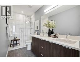 132 Quesnay Wood Link Sw, Calgary, AB T3E8H6 Photo 24