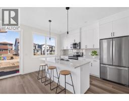 Laundry room - 202 Starling Boulevard Nw, Calgary, AB T3P3E1 Photo 11