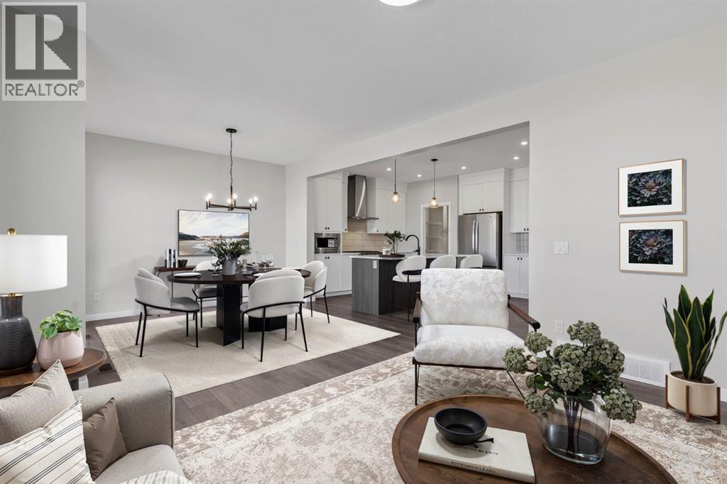 Open concept living room, dining room and kitchen space is the heart of the home