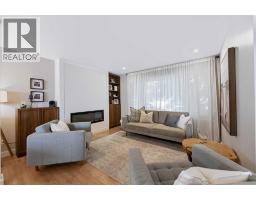 Living room - 115 Flavelle Road Se, Calgary, AB T2H1E8 Photo 6