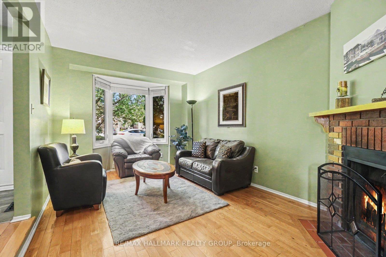 Liv Rm w/ Bay window and wood burning fireplace