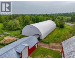 Barn with covered pass through to indoor riding arena