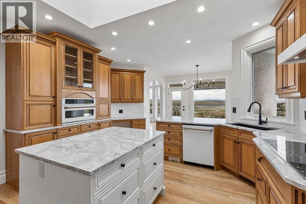 Cook and entertain while taking in the scenery, with expansive windows drawing the surrounding landscape into this beautifully appointed kitchen