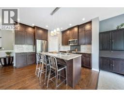 Dining room - 64 Sunrise Terrace, Cochrane, AB T4C0V3 Photo 7