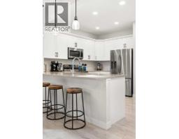 Living room - 203 Hamptons Crescent Se, Medicine Hat, AB T1B0P4 Photo 11