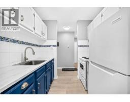 Living room - 207, 635 56 Avenue Sw, Calgary, AB T2V0G9 Photo 7