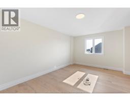 Family room/Fireplace - 3586 Sutton Avenue, Windsor, ON N9E0A6 Photo 13