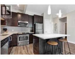 Living room - 205, 4 Sage Hill Terrace Nw, Calgary, AB T3R0W4 Photo 6