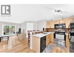 Living room - 110, 6315 Ranchview Drive Nw, Calgary, AB T3G1B5 Photo 7