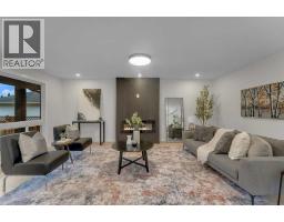 Living room - 104 Oakmoor Place Sw, Calgary, AB T2V4A3 Photo 6
