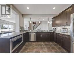 Family room - 64 Heritage Green, Cochrane, AB T4C0L3 Photo 15