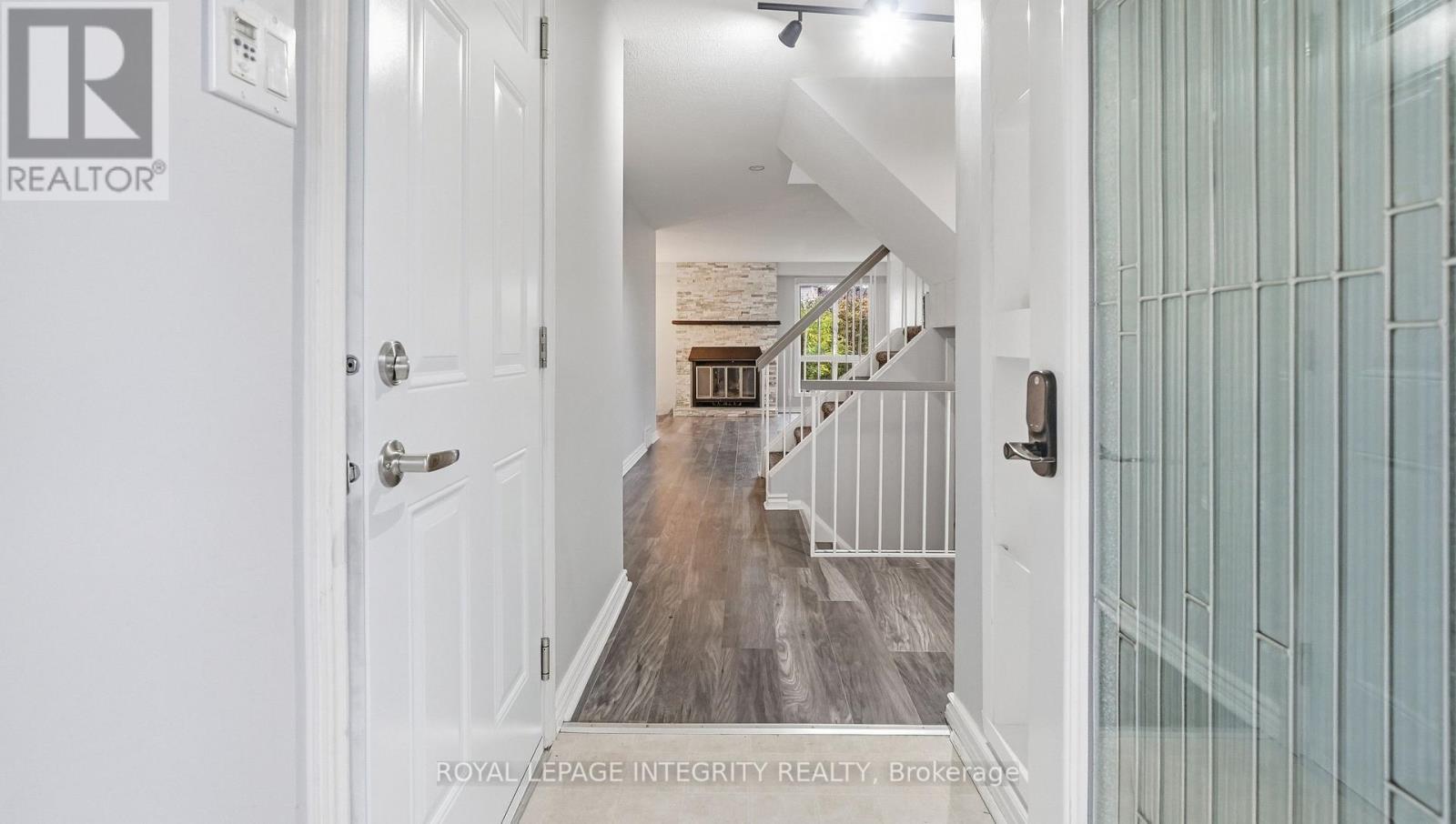 Front door view into an airy open stairwell