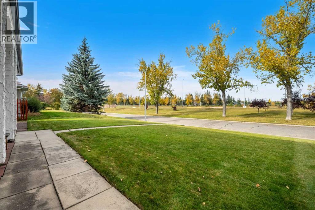 Facing a green space / dog park